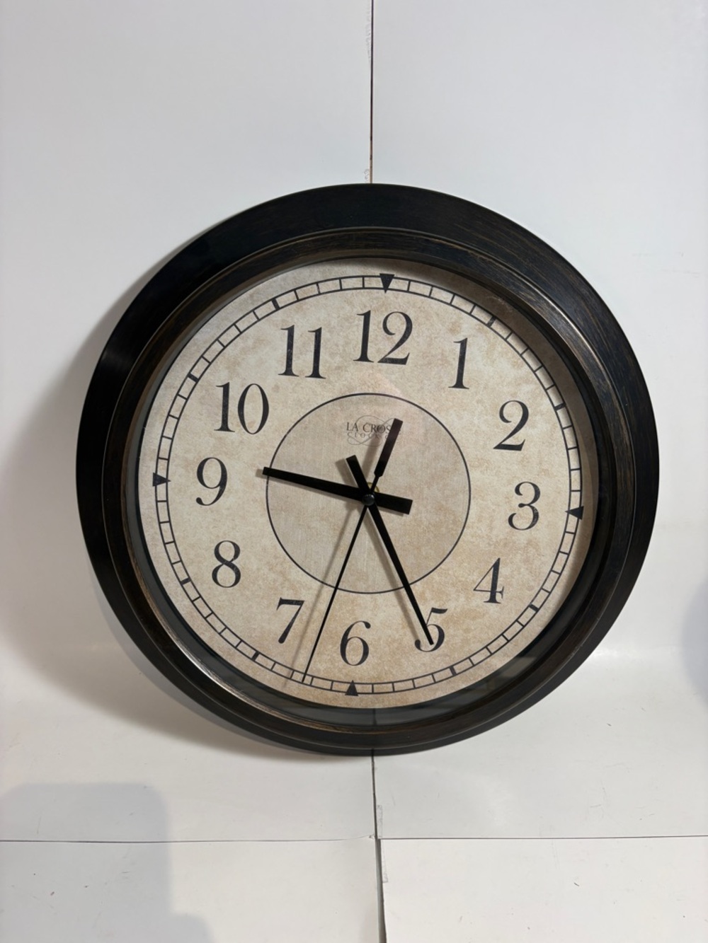 LaCrosse Black and Cream Round Wall Clock Size Pictured